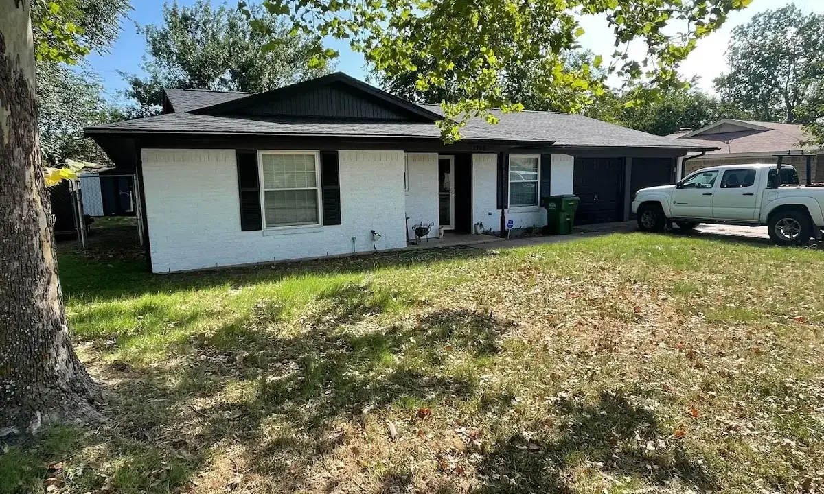 Professional roofing crew working on a residential roof in Northborough